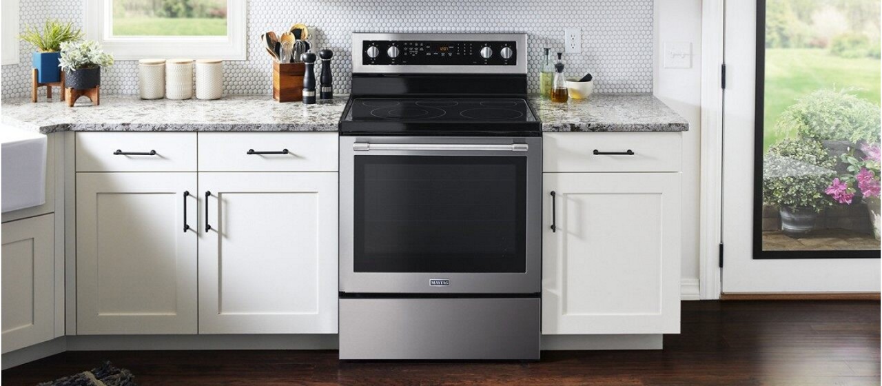 Freestanding electric range in a white kitchen