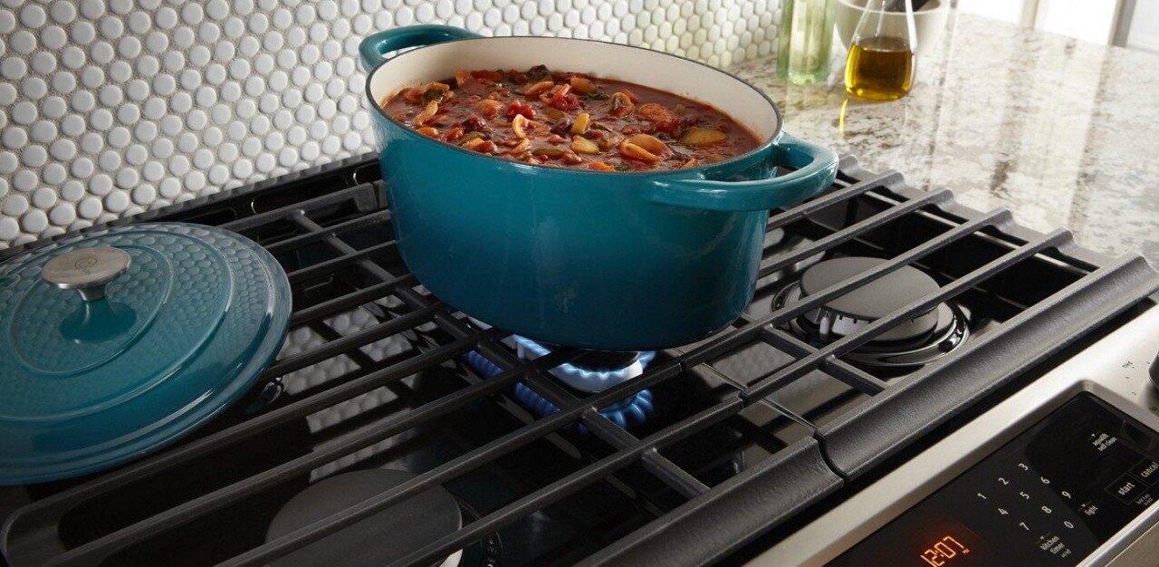 Stew cooking in an oval dutch oven on a gas stove