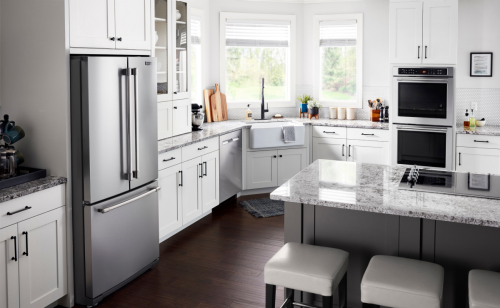 A wall oven in a white modern kitchen