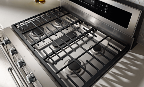 A close up image of stove grates on a gas range.