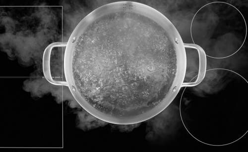 Pot of water boiling on a cooktop