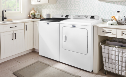 Laundry room with a white Maytag® washer and dryer