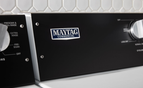 A closeup of a Maytag® commercial badge