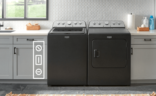 A black Maytag® washer and dryer surrounded by countertops
