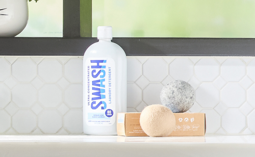 Swash® on a counter with wool dryer balls