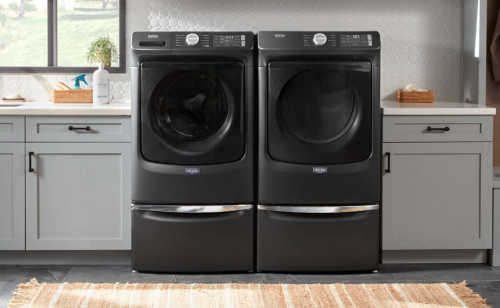 Maytag® side-by-side washer and dryer set in a modern laundry room