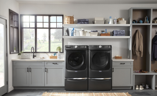 Laundry room featuring Maytag® washer and dryer