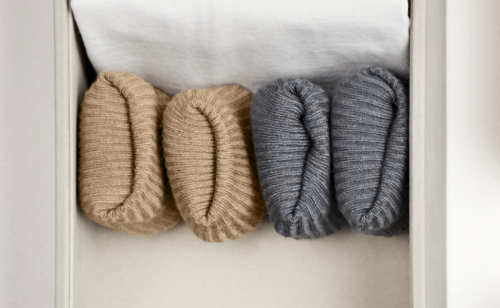 A set of folded, hand-knitted items