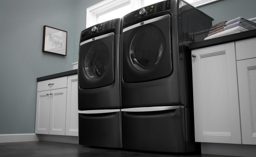 A Maytag® washer and dryer pair in a laundry room