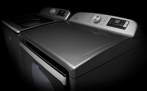 The consoles of a Maytag® top load washer and dryer
