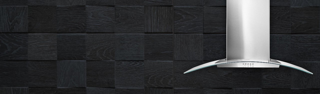 A stainless steel vent hood against a black background.