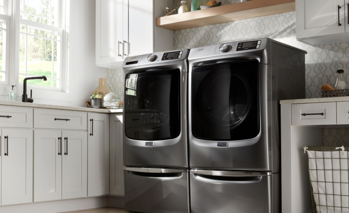 Laundry room with Maytag top load washer and dryer