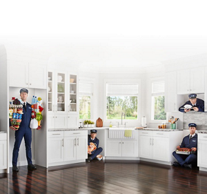 The Maytag Man inside a refrigerator, dishwasher, range and microwave cutout in a kitchen