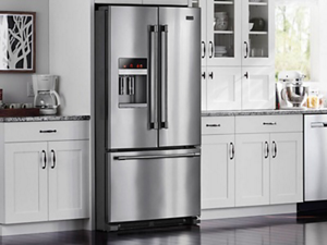 French door refrigerator in a bright, white kitchen