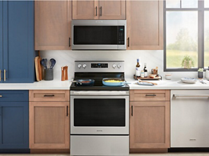 Stainless steel Maytag® over-the-range microwave above an electric Maytag® range