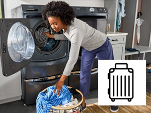 Person putting clothes in Maytag@ front load washing machine