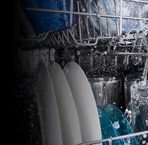 Dishes getting washed in a Maytag® dishwasher