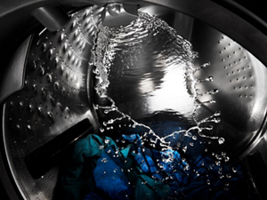 Water splashing around the inside of a washer drum