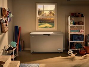 A Maytag® chest freezer in a garage