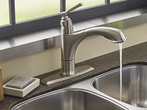 Kitchen sink with water running