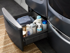  Laundry and cleaning supplies in pedestal below washer