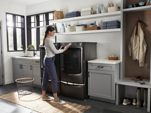 A person doing laundry in a laundry room