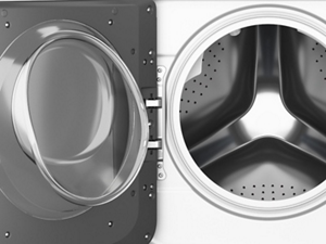 Washing machine door open to show inside of drum