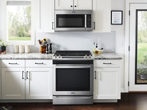 Over-the-range microwave sitting above a slide-in range
