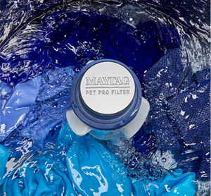 The Maytag® Pet Pro Filter surrounded by water in a washing machine.