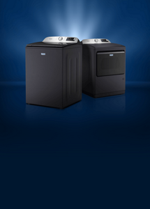 Angled Maytag® washer and dryer with light coming from behind